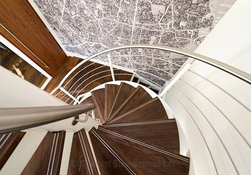 looking down on a walnut step spiral staircase