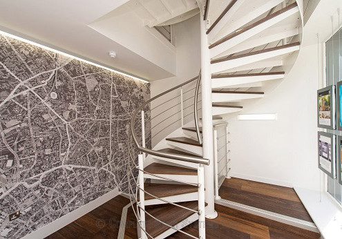 white steel and walnut spiral staircase