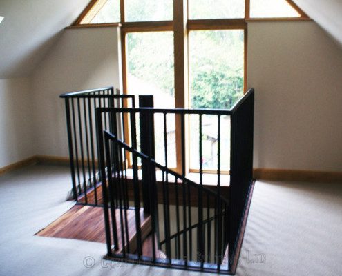 square stairwell with black balustrade