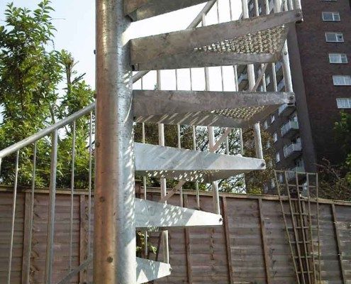 block of flights behind a spiral staircase