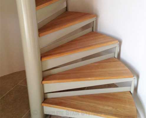 lower steps on an oak spiral staircase with steel centre column