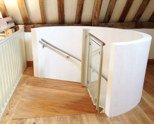curved white plastered wall around a circular stairwell