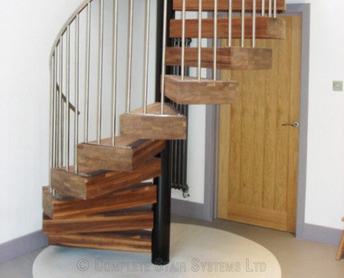 walnut step spiral staircase with stainless steel spindles