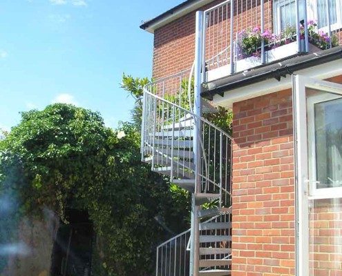 outdoor spiral staircase to back of house