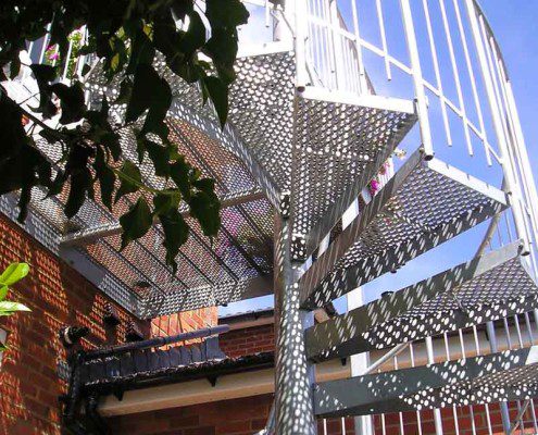 perforated steel steps on a spiral staircase outside
