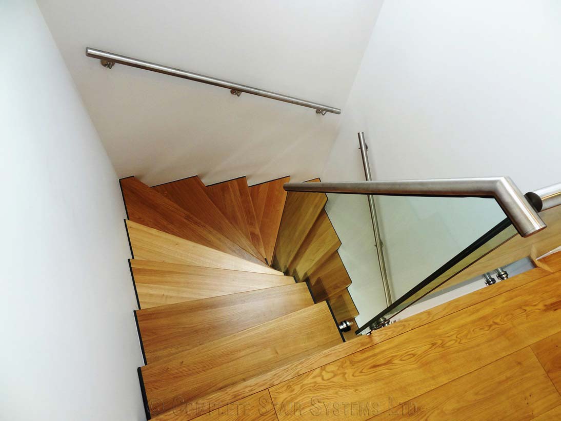 Bespoke Staircase Chiswick - Model 500 stainless steel handrail on an oak twisting staircase