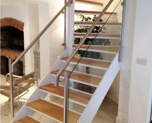 glass panels to spiral staircase in white steel