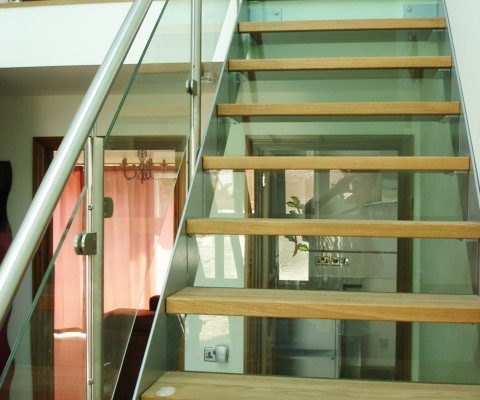 see through risers on a staircase with oak treads