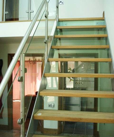 Bespoke Staircase Weymouth 1 see through risers on a staircase with oak treads