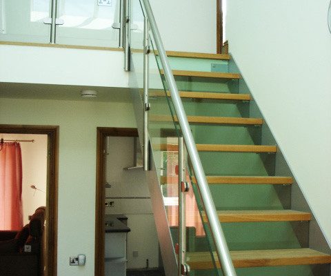 glass riser and side panels on a steel stair