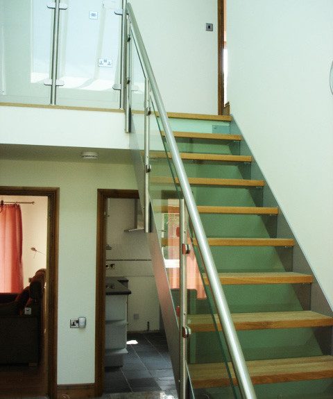 Bespoke Staircase Weymouth 3 glass riser and side panels on a steel stair