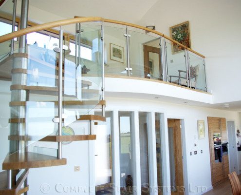 walkway overlooking a kitchen and living space