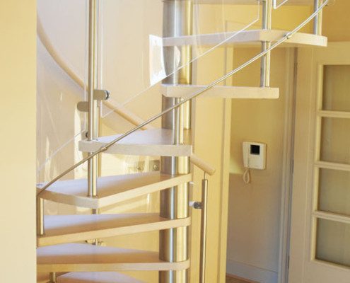 timber floor in a house with a light wood spiral staircase