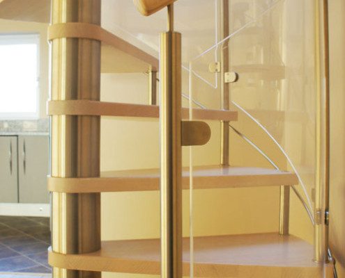 close up of curved glass panels on a spiral staircase