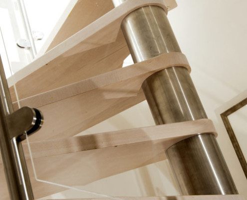 curved glass panels on a spiral stair with stainless steel centre column
