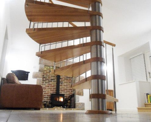 tiled floor with oak spiral stair with stainless steel spindles