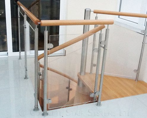 landing balustrade with glass panels over a stairwell