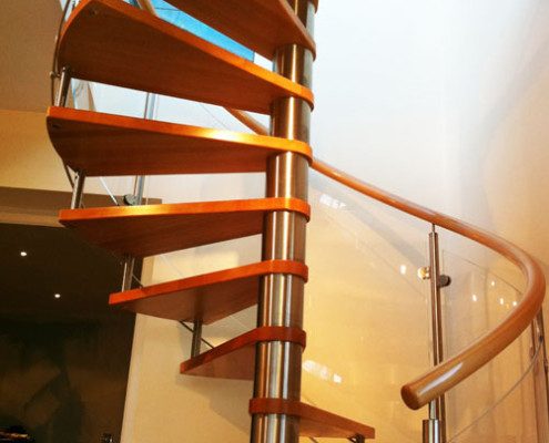 wooden spiral staircase with stainless steel spindles