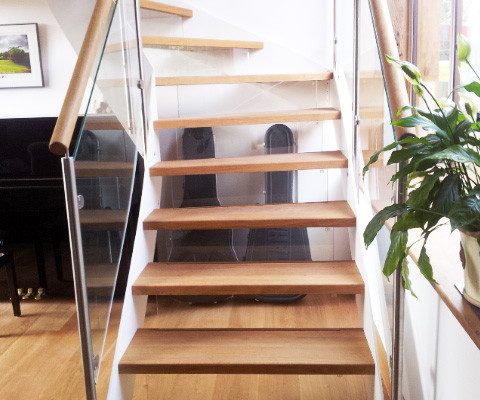see through staircase with piano behind
