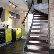 kitchen below a quarter turn stair with open risers