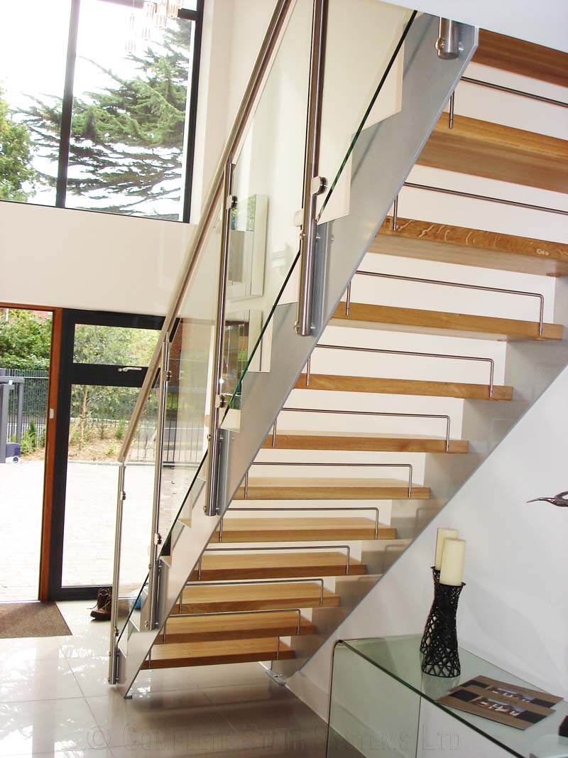 Bespoke Staircase Poole - Model 500 rear of open riser staircase with steel stringers and glass panels