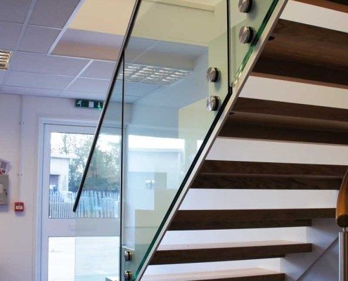Bespoke Staircase Romsey - Model 500 open risers on a steel and glass staircase in office