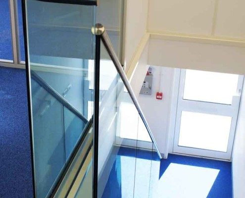 Bespoke Staircase Romsey - Model 500 blue carpet in office with oak staircase