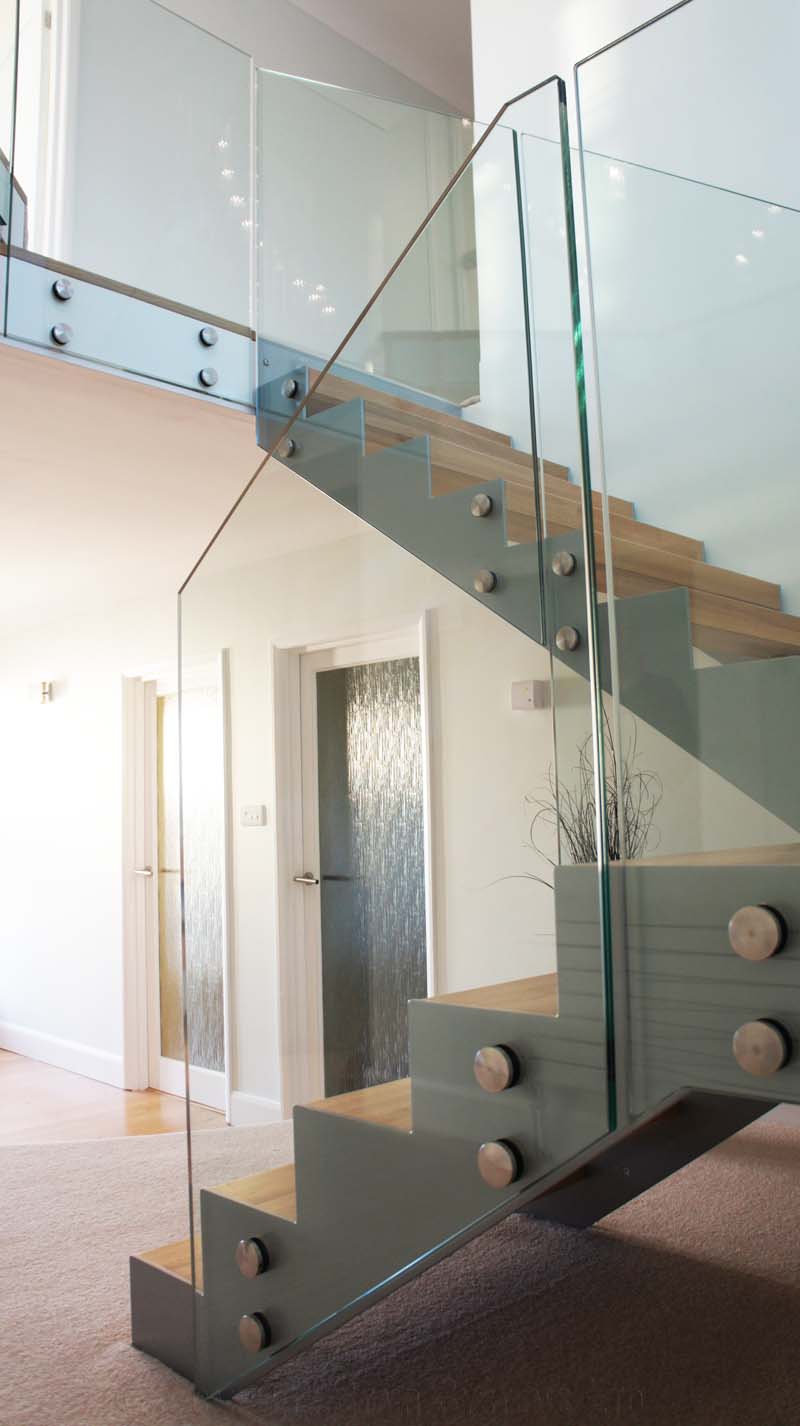 Bespoke Staircase Southampton - Model 500 grey steel stringers with glass panels on a staircase
