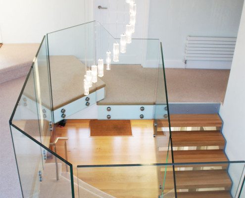 glass landing balustrade around a stairwell