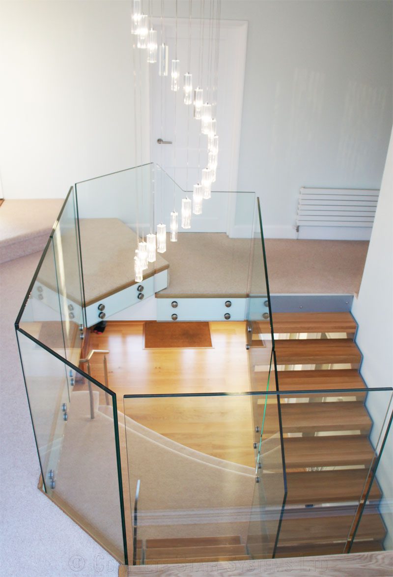 Bespoke Staircase Southampton - Model 500 glass landing balustrade around a stairwell
