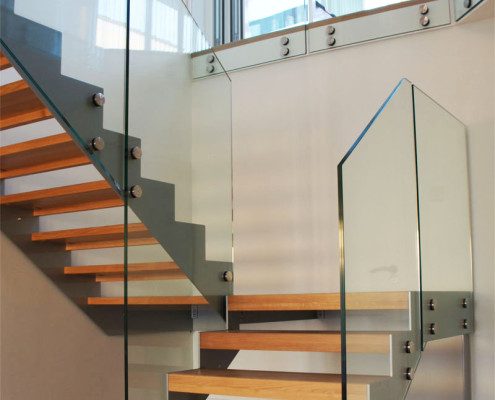 half turn stair with large platform with grey stringers in steel