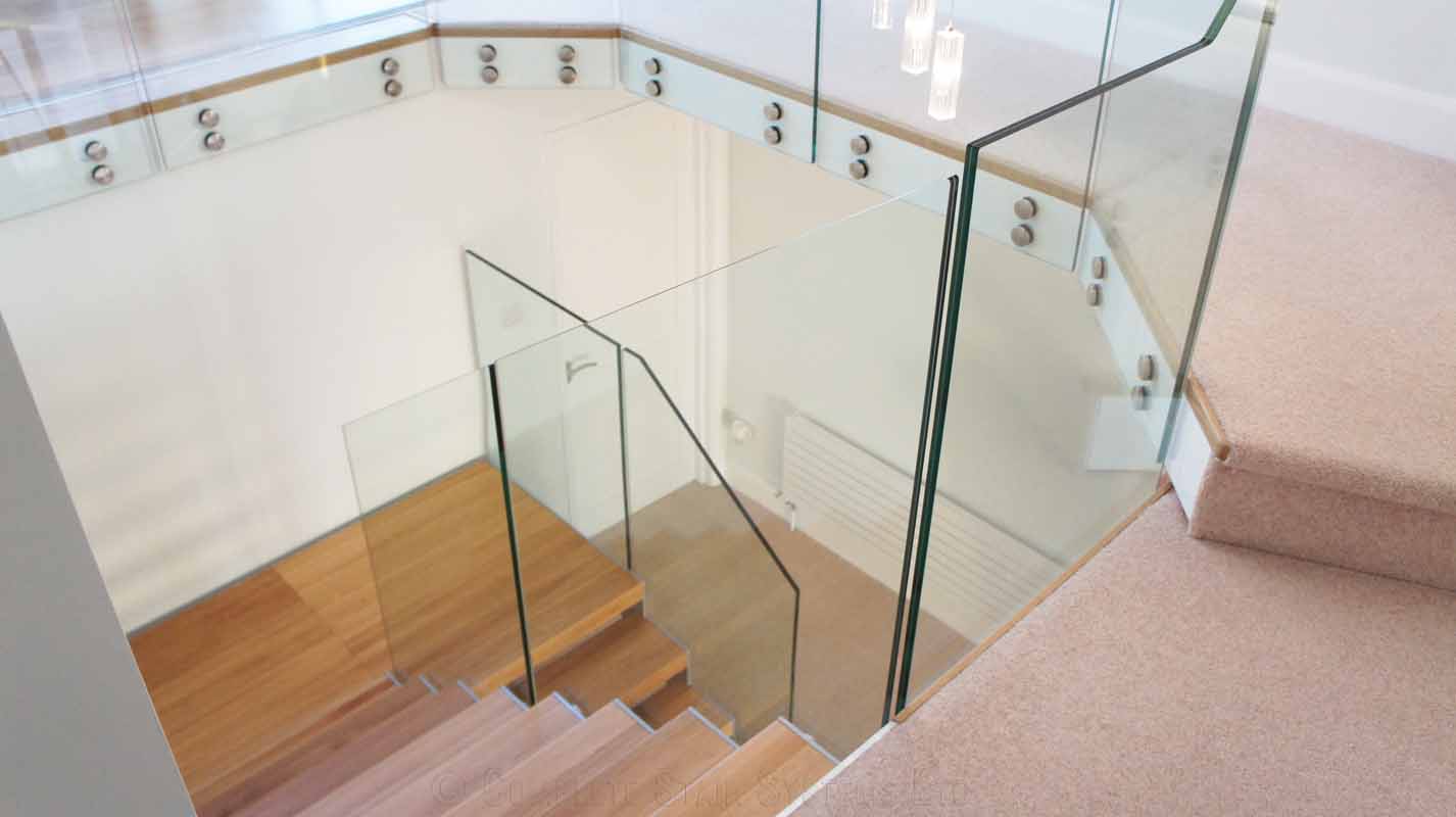 Bespoke Staircase Southampton - Model 500 glass balustrade around a stairwell