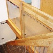 landing balustrade with glass panels over a stairwell