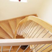 half turn stair with curved handrail
