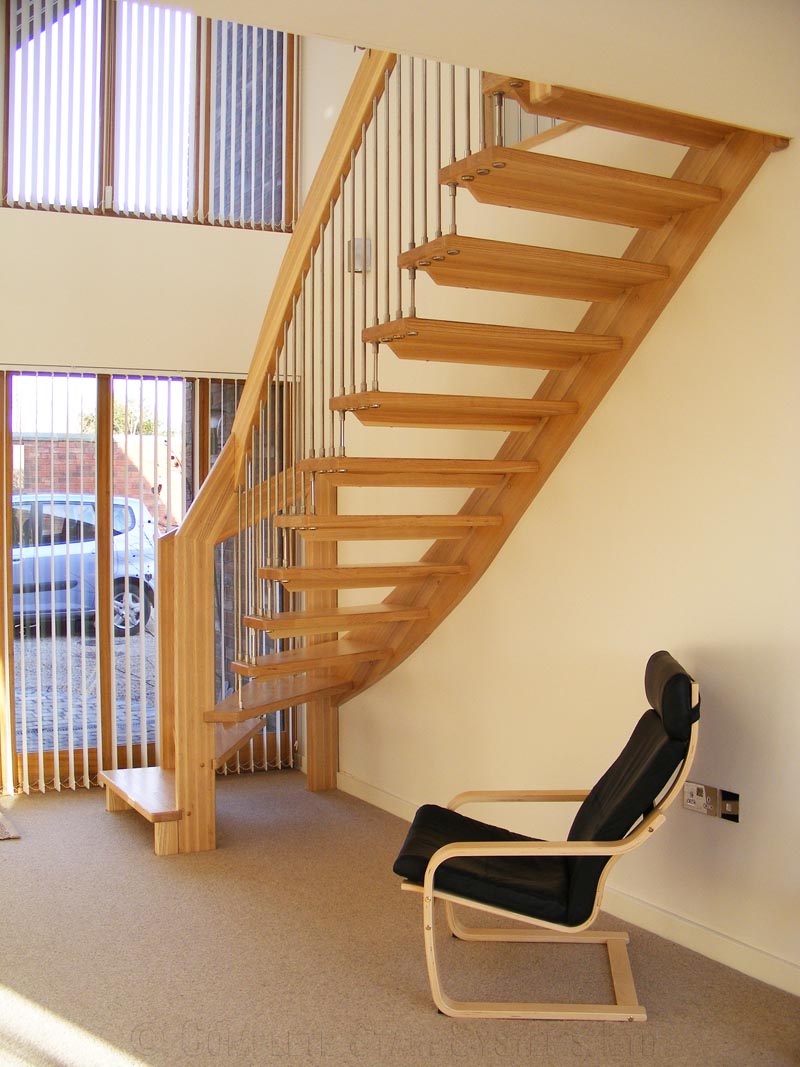 flooring style oak staircase with black chair below