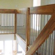 landing balustrade with stainless spindles around an stairwell opening