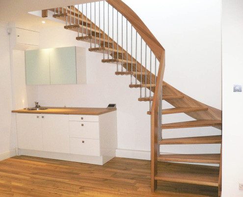 kitchen work surface below and floating timber staircase with open risers