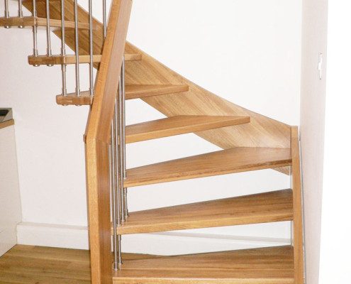 winding steps on a floating staircase with open risers