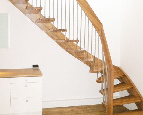 quarter turn oak stair in floating style on a timber floor