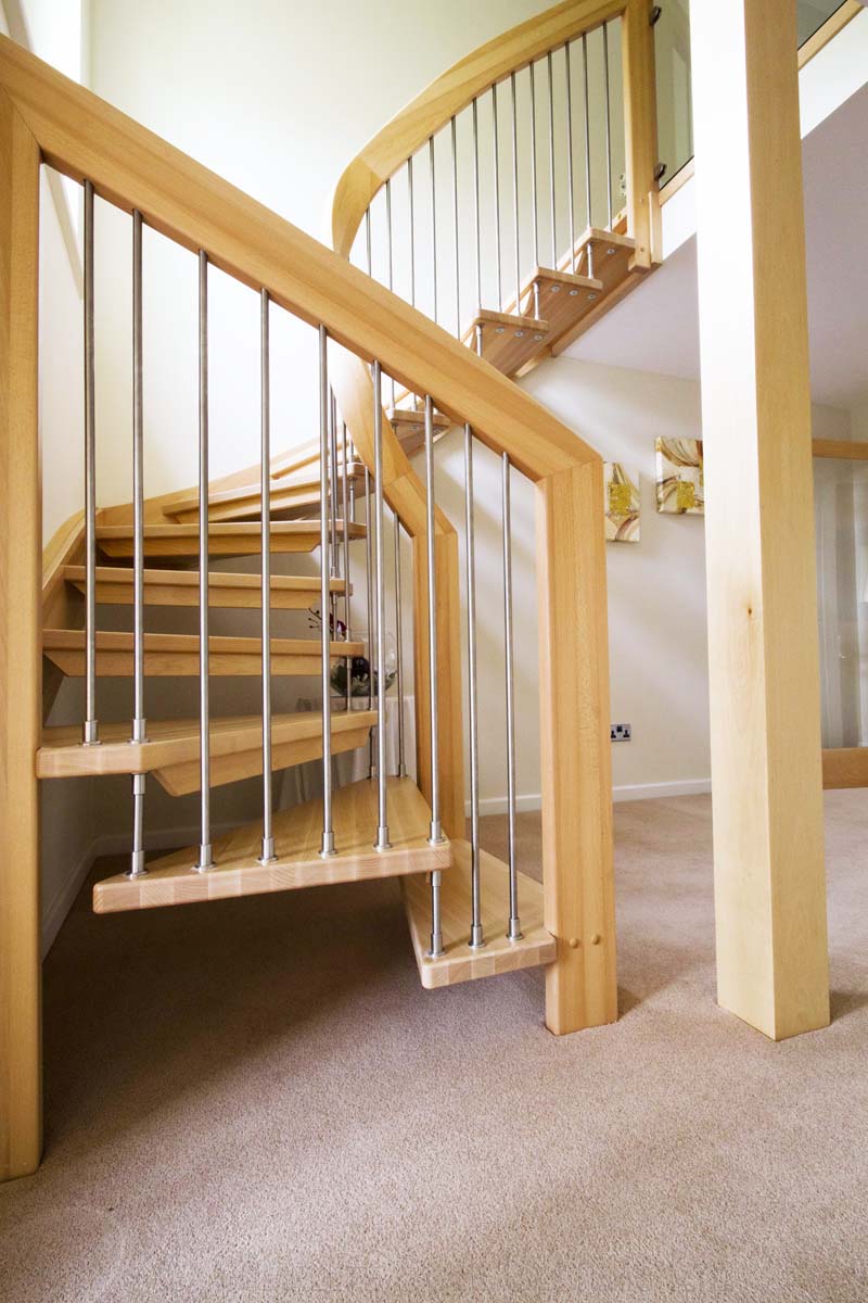 Bespoke Timber Staircase Tadley open wooden staircase on a carpeted staircase
