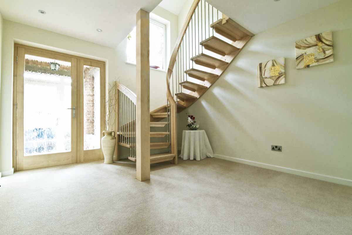 Bespoke Timber Staircase Tadley carpeted floor with half turn curving floating staircase