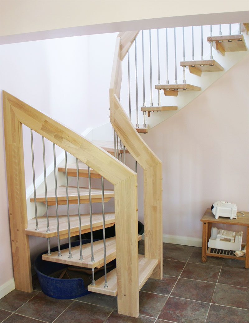floating style open staircase with dog bed below