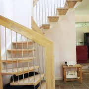 tiled floor in house with half turn staircase with open staircase