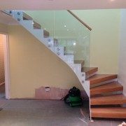 Modern Staircase – Model 500 5 white zig zag steel staircase with frameless glass panels