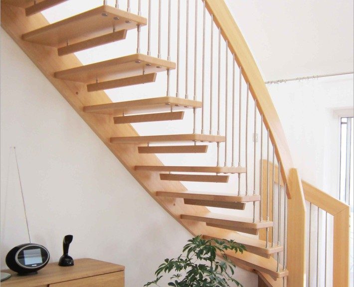 open beech staircase with plant below