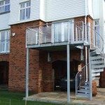 outdoor spiral stair with balcony with glass panels