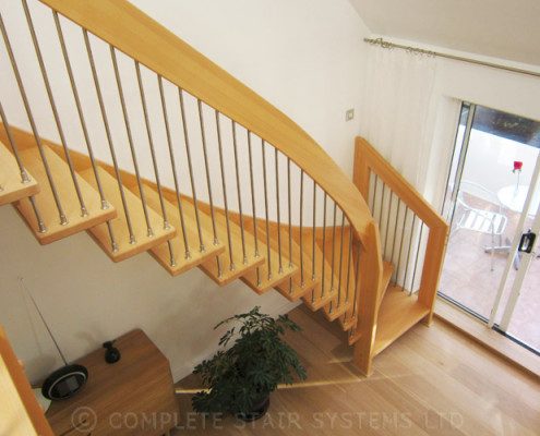 looking down upon a timber stair with floating steps