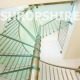 glass step spiral staircase with a stainless centre column