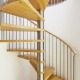 spiral stair with stainless spindles and oak treads