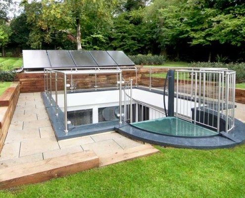glass balustrade around a courtyard with a spiral stair with a glass panels